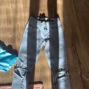 Grey skinny jeans with ripped knees